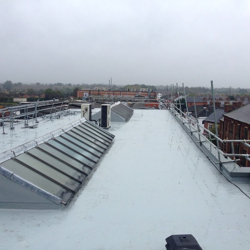 Liquid applied membrane around plant on a commercial roof