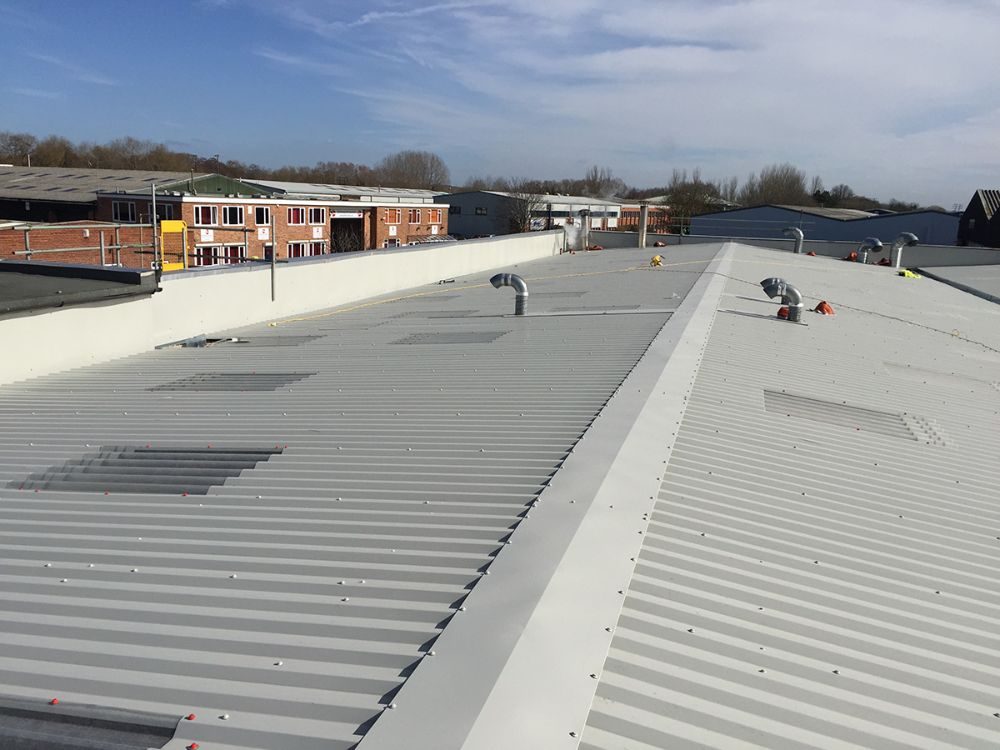 Overclad industrial roof with new rooflights
