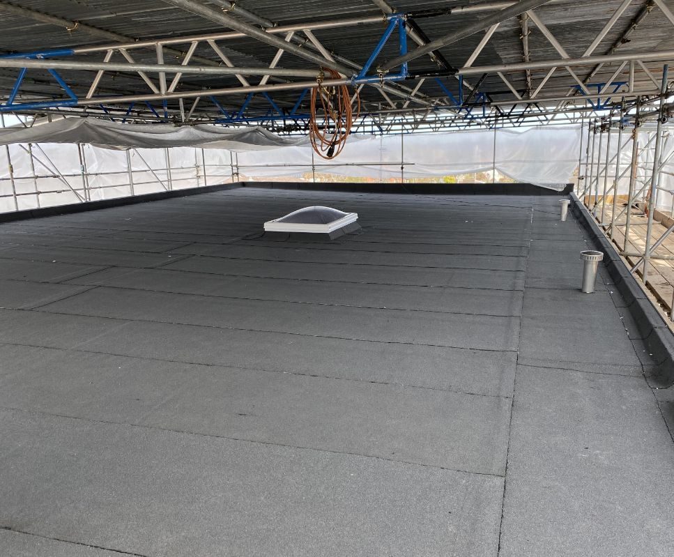 New membrane roof under the temporary roof, with a replacement rooflight, Tiffany Court, Leicester