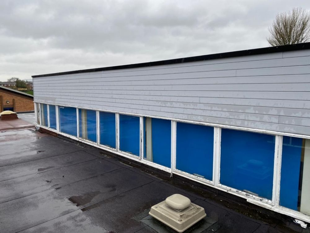 Refurbished flat roof and new cladding to the raised block, Windmill Primary School, Telford
