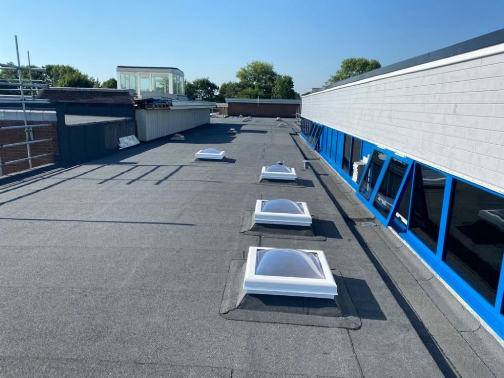 Completed warm roof with new rooflights and cladding, Windmill Primary School, Telford