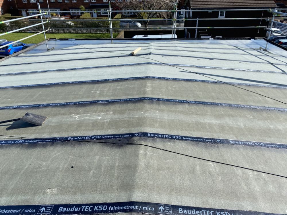 Membrane rolls laid out on a public sector roof